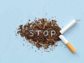Cigarro partido ao meio com a palavra STOP